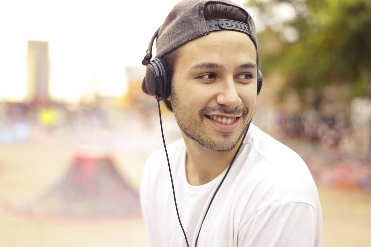 Man listening to podcast on headphones